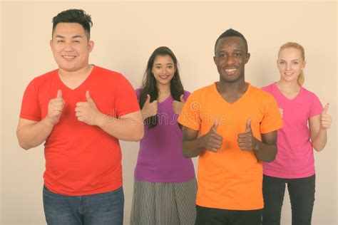 Studio Shot Of Happy Diverse Group Of Multi Ethnic Friends Smiling