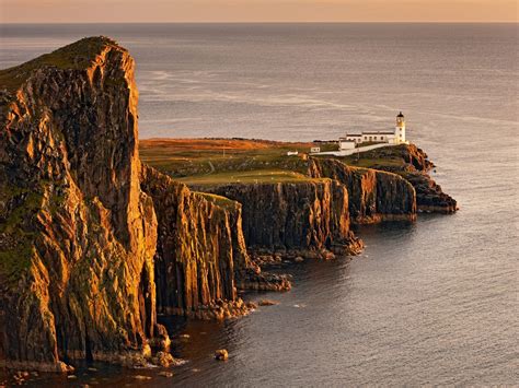 View Of Sea Cliffs And Lighthouse At Sunset Neist Point Lighthouse