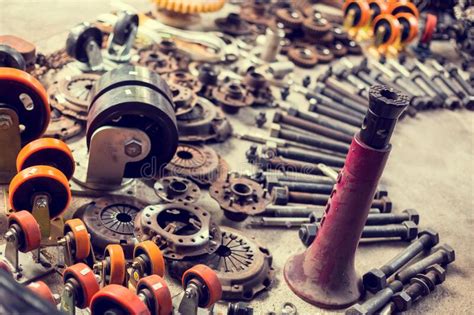 Many Tools And Old Auto Spare Parts Car At A Car Repair Shop Car Parts