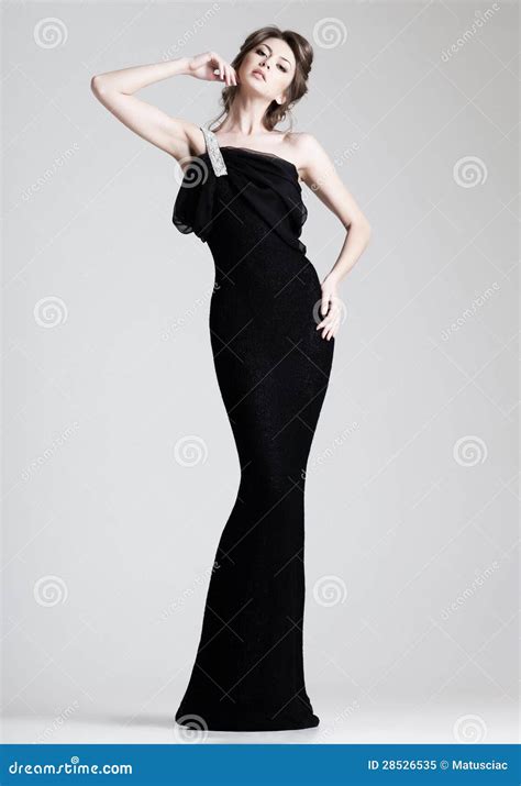 Beautiful Woman Model Posing In Elegant Dress In The Studio Stock Image