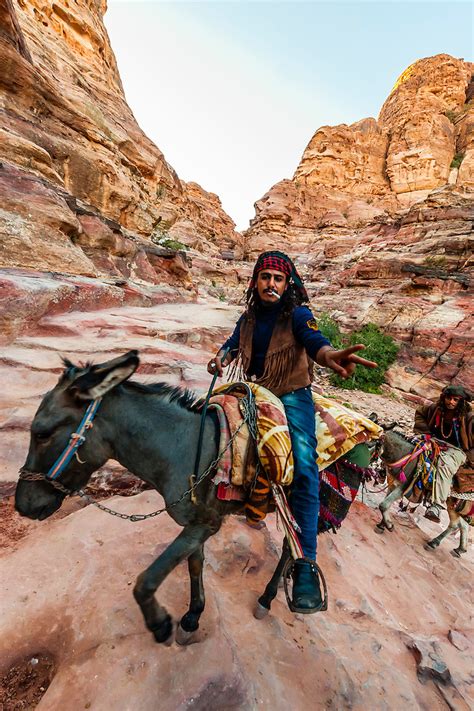 Bedouin Men On Donkeys Climbing The 800 Steps That Lead To The