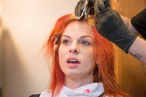 Woman Getting Hair Dyed Red Stock Photo Download Image