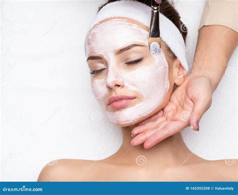 Woman Receiving Facial Mask At Beauty Salon Stock Photo Image Of