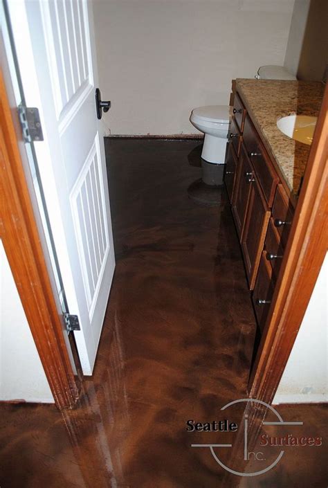 If you plan on placing carpet, hardwood or another flooring material on top of a concrete basement floor, consider applying a few coats of epoxy to the concrete before laying the floor. Designer Epoxy Basement Floor After Failed DIY | Basement ...