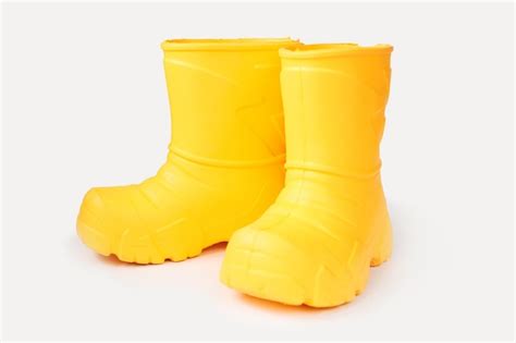 Premium Photo Pair Of Yellow Rubber Boots On White Background