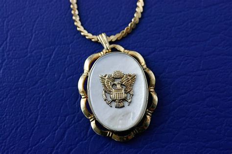 this beautiful 1940 s gold filled and mother of pearl military sweetheart locket has a