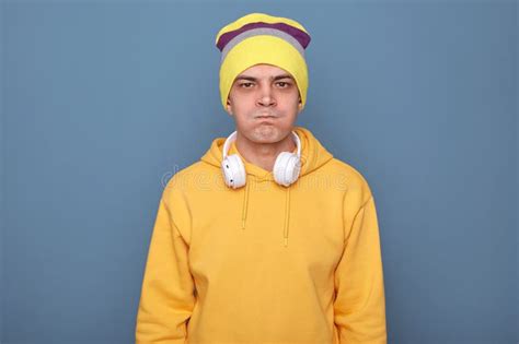 Image Of Angry Caucasian Young Adult Man Wearing Beanie Hat And Casual