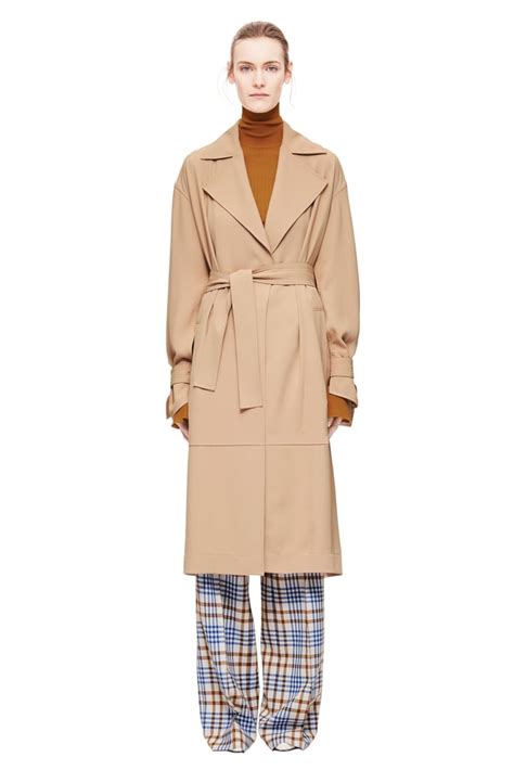 Victoria Beckham S Trench Coat Victoria Beckham In Trench Coat And Plaid Pants Popsugar