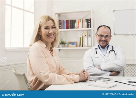Happy Doctor Consulting Woman In Hospital Stock Image Image Of Health
