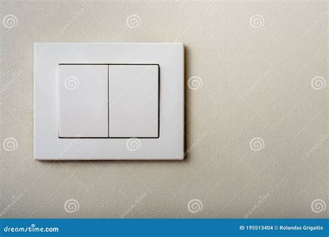Close Up White Light Switch With Ivory Color Texture Background Stock