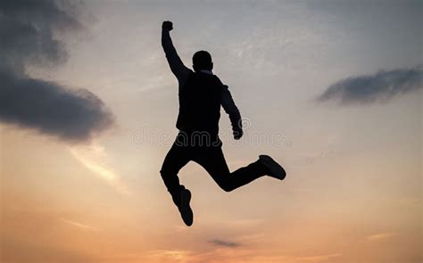 Man Jump High Silhouette Full Of Energy Against Sunset Sky Energy