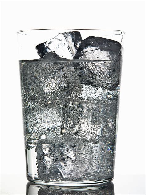 Glass Of Ice Cubes In Fizzy Drink Photograph By Walter Zerla