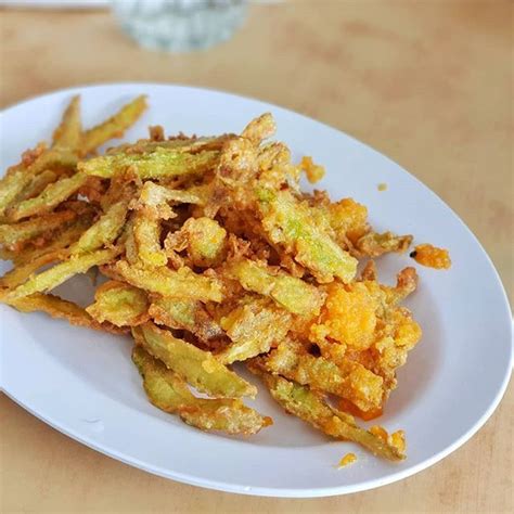 Pour the beaten egg slowly over the bitter gourd slices. Por Kee's Crispy fried salted egg yolk bitter gourd. I ...