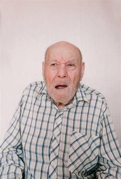 A Large Portrait Of An Old Man On A Light Background With Deep Wrinkles