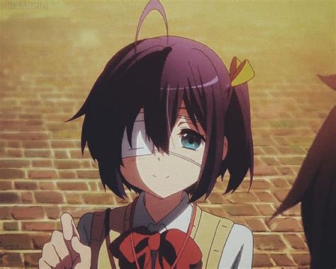 An Anime Character Is Standing In Front Of A Brick Wall And Pointing To