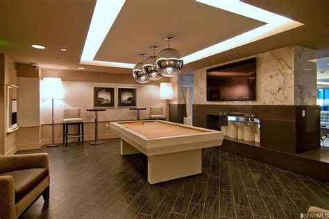 Modern Game Room With Pendant Light And Hardwood Floors In