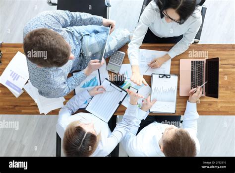 Business People At Their Desk Give Each Other Five Stock Photo Alamy