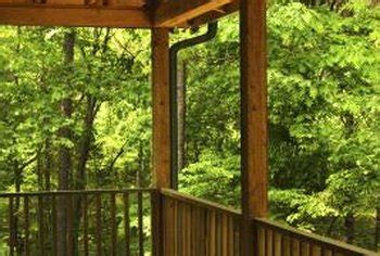 An inch or two higher than the railing will look nice. U.S. Building Codes for Deck Railing | Home Guides | SF Gate