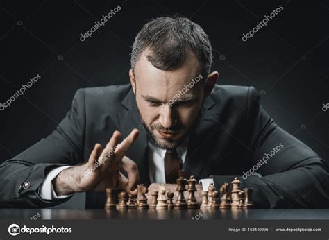 Businessman Playing Chess Stock Photo By ©tarasmalyarevich 163440996