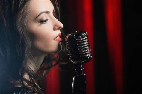 Premium Photo Portrait Of Beautiful Woman Singing In Microphone