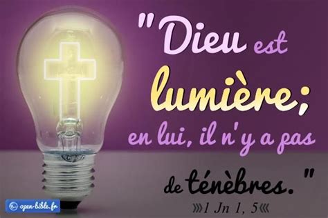 A Light Bulb With A Cross On It And The Words Dieu Est Lumiee