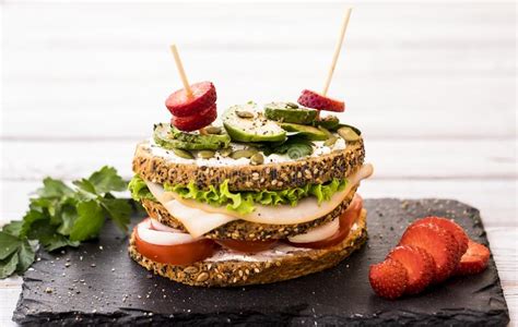 Three Layer Sandwich With Variety Of Vegetables Turkey Meat And