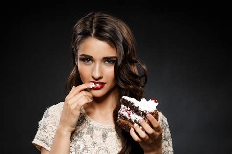 Free Photo Sexy Woman In Creamy Dress Holding Piece Of Cake