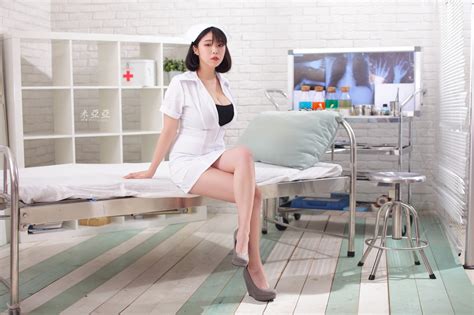 Wallpaper Brunette In Bed Sitting Cleavage Legs Nurses Nurse Outfit Looking At Viewer