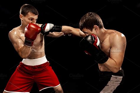 Two Professional Boxer Boxing On Black Background Featuring Boxing