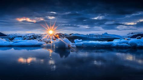 Sun Setting Over Icy Winter Ocean
