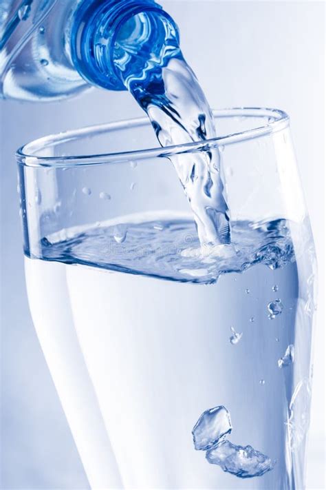 Pouring Water From Bottle Into Glass Stock Photo Image Of Healthy