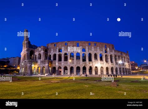 Coliseum By Night With Full Moon In Roma Italy Stock Photo Alamy