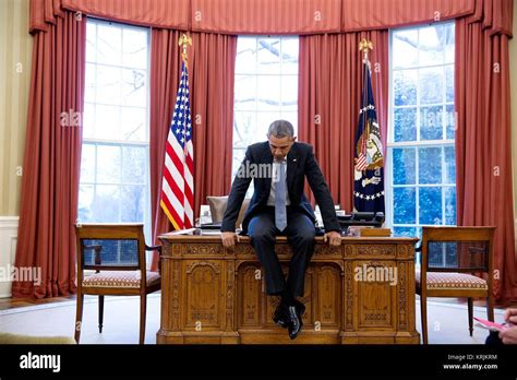 Collectables President Barack Obama Tries Out Desk Chairs In The Oval Office Photo Print