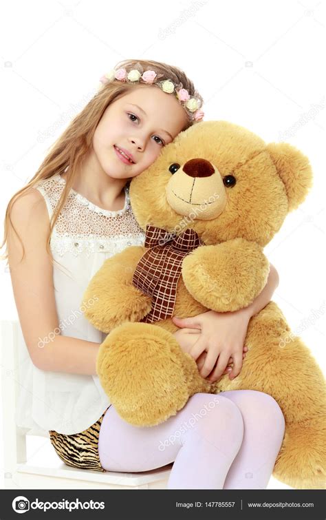 Girl Holding A Large Teddy Bear Stock Photo By ©lotosfoto1 147785557