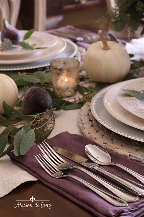 Warm Thanksgiving Table In Shades Of Plum With Greenery And Figs