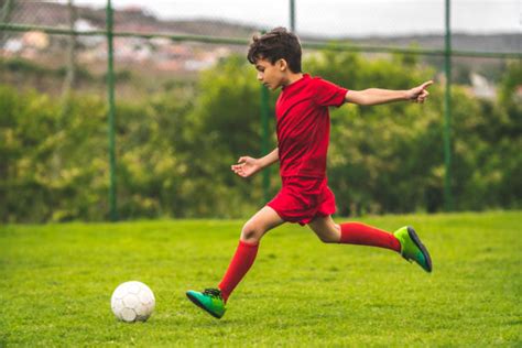 14700 Kid Kicking Soccer Ball Stock Photos Pictures And Royalty Free