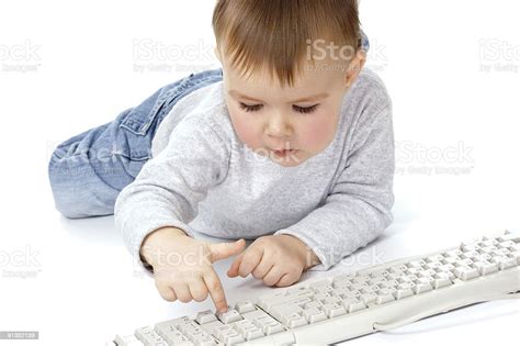 Cute Child Typing On A Keyboard Stock Photo Download Image Now Baby