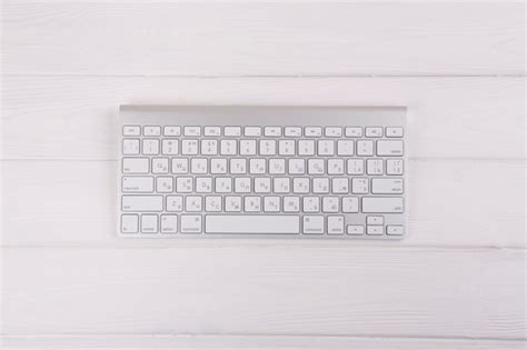 Free Photo White Keyboard On Wooden Table
