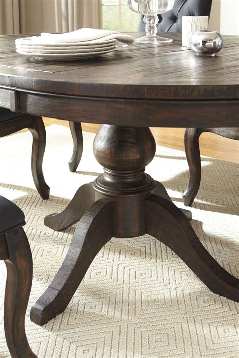 Trudell Dark Brown Round Extendable Pedestal Dining Table From Ashley