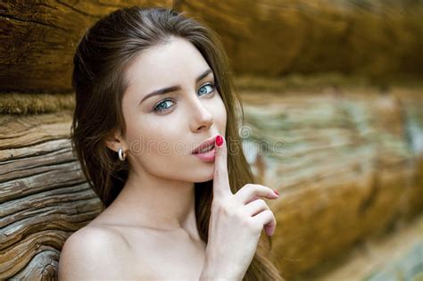 Portrait Of Attractive Young Woman With Finger On Lips Stock Image Image Of Logs Perfect