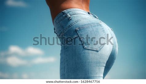 Woman In Jeans Close Up Beautiful Female Hips And Buttocks On A Sky