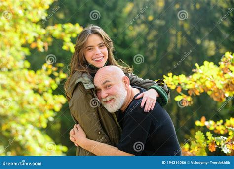 happy elderly father and daughter enjoying tender autumn moment smiling grown up daughter