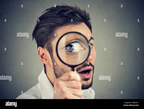 Looking Through A Magnifying Glass Stock Photos And Looking Through A