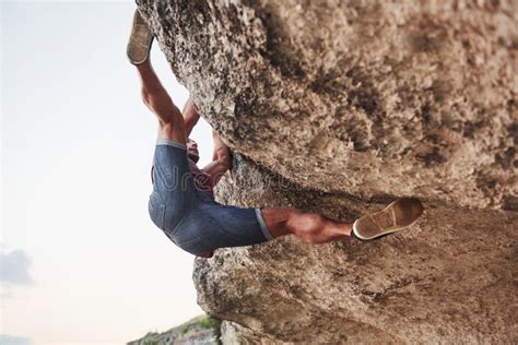 A Young Man Climbers Climb A Rock Extreme Rest Style Of Life Free And