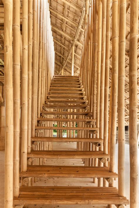 Arching Bamboo Trusses Are Left Exposed In Chiang Mai Sports Hall To