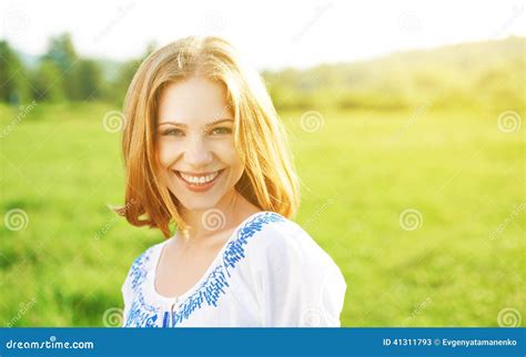 Happy Beautiful Young Woman Laughing And Smiling On Nature Stock Photo