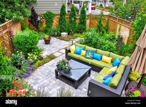 This Beautiful Small Urban Backyard Garden Features A Tumbled Paver