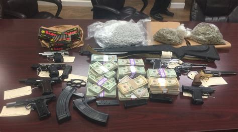 Authorities 108049 Cash Drugs Guns Seized In Bentonville Search