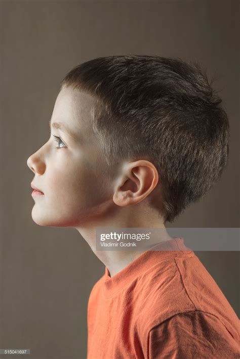 Profile Shot Of Boy Looking Away Over Colored Background Side