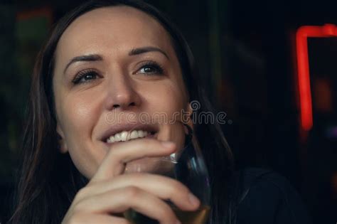 Portrait Of Attractive Caucasian Smiling Woman Drinking Glass Of White